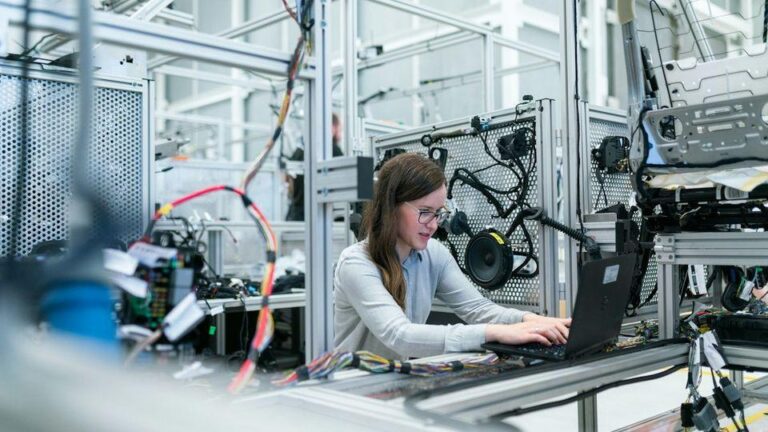 Engineers and technical specialists collaborating in a high-tech Danish industrial facility in Copenhagen